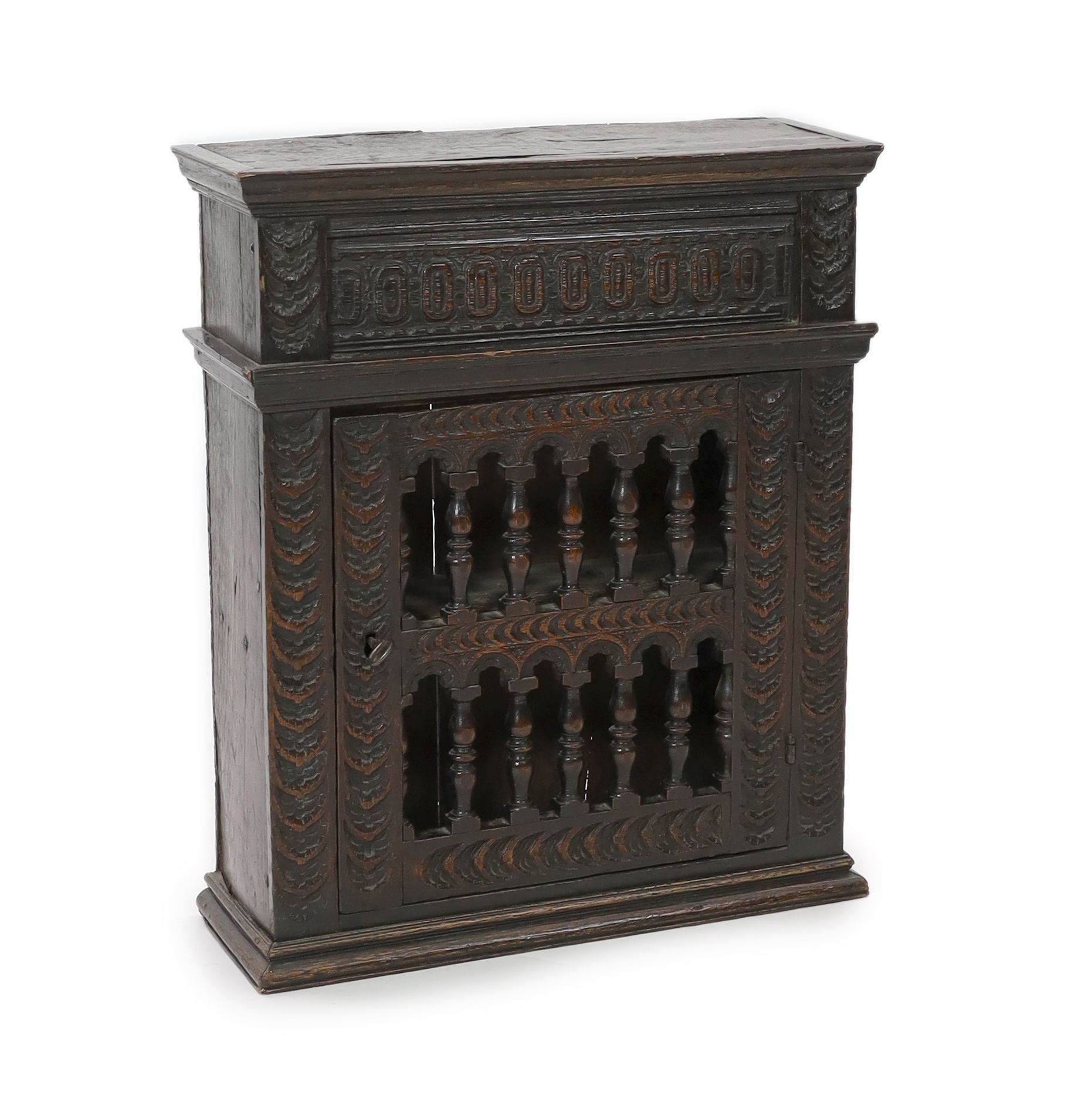 A 17th century oak dole cupboard, width 62cm depth 23cm height 74cm